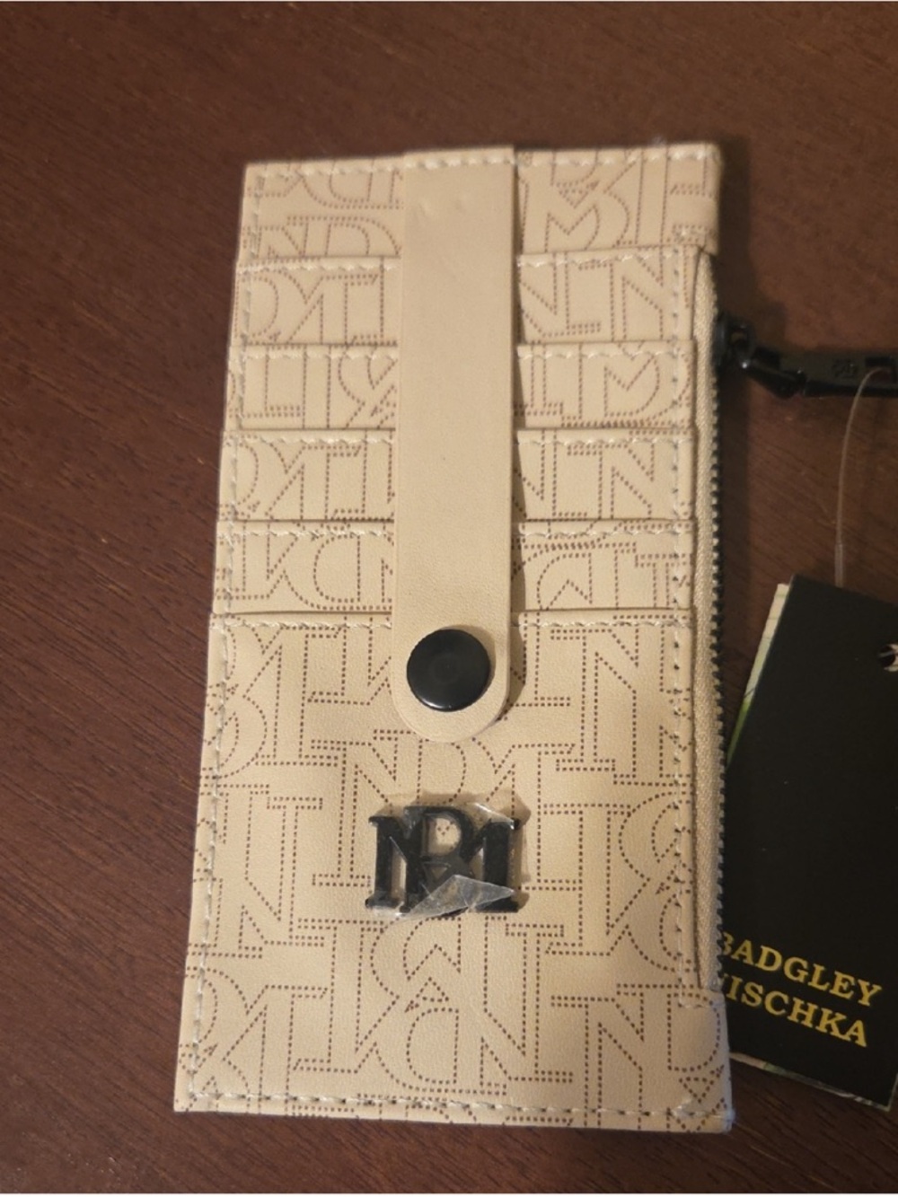 Bagley Mischka Cream Logo Card Holder with Snap Strap and Metal Emblem